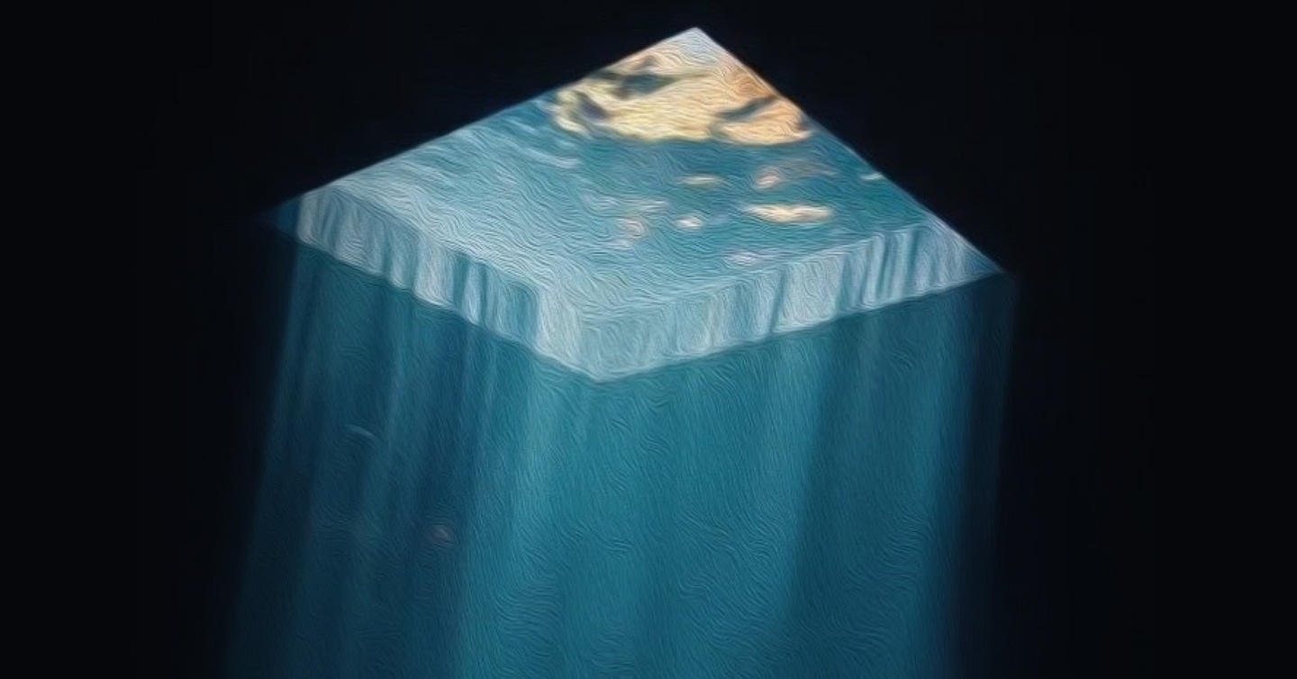 Un cubo de luces azules y amarillas, como hechas de cielo, sobre un fondo negro